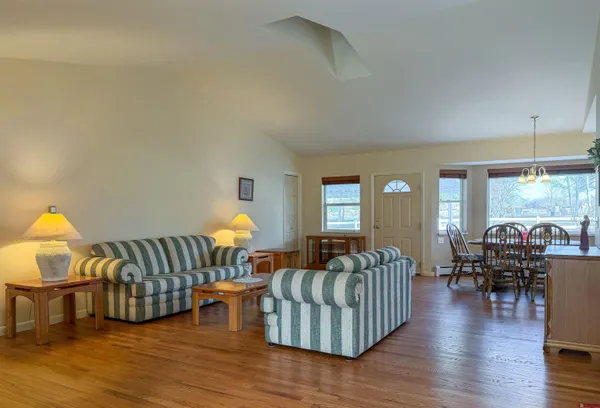 a bed sitting in a room next to a window