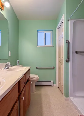 a bathroom with a shower and a tub
