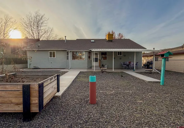 a view of backyard with seating space
