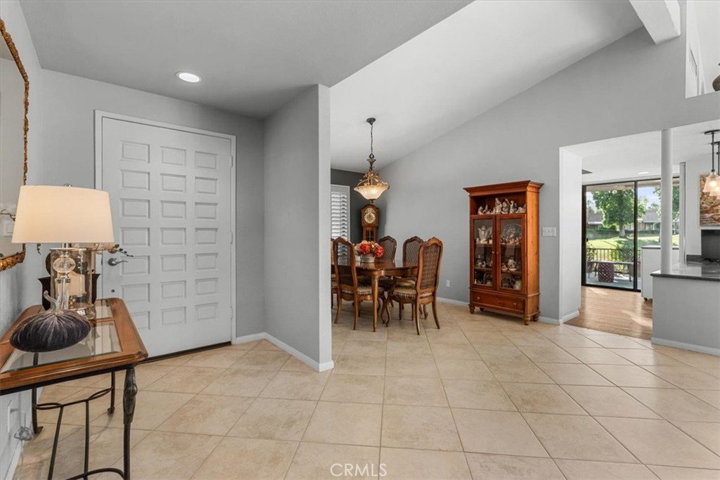 393 Gran Via Palm Desert, CA 92260 - Photo 11 of 60 a view of a livingroom with furniture and a potted plant
