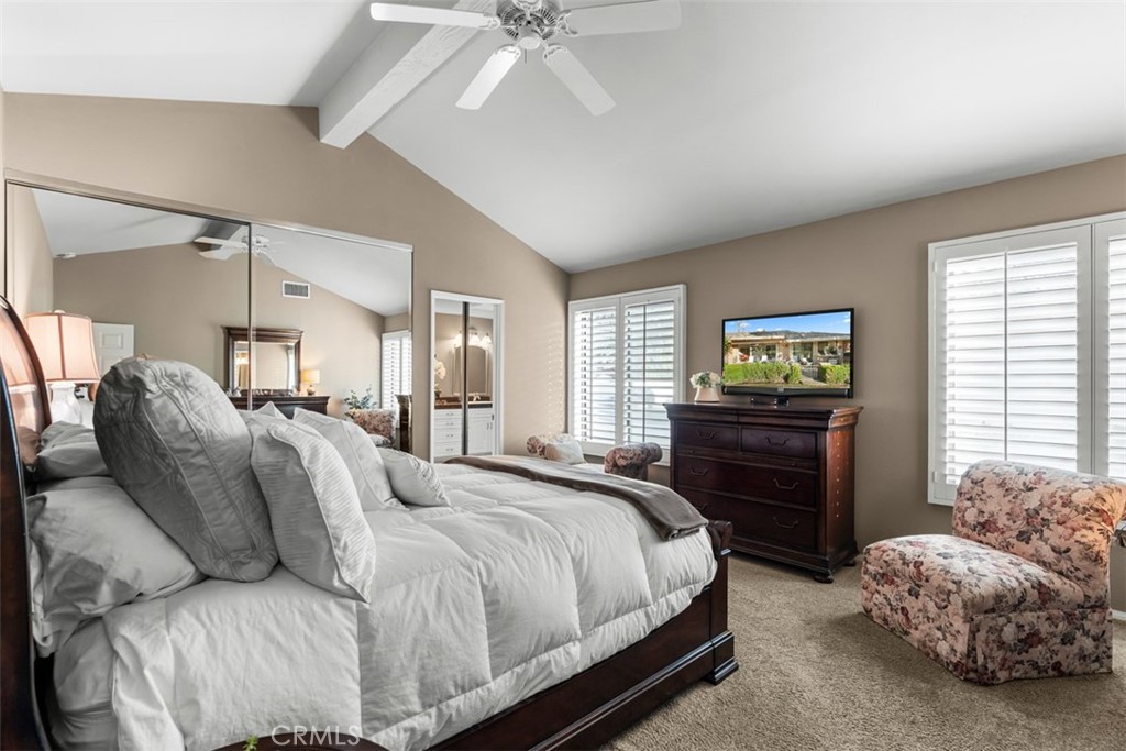 393 Gran Via Palm Desert, CA 92260 - Photo 20 of 60 a bedroom with a bed and a tv