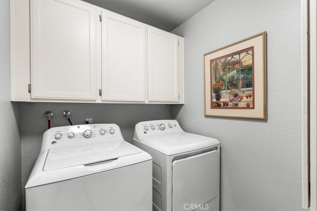 393 Gran Via Palm Desert, CA 92260 - Photo 28 of 60 a utility room with dryer and washer