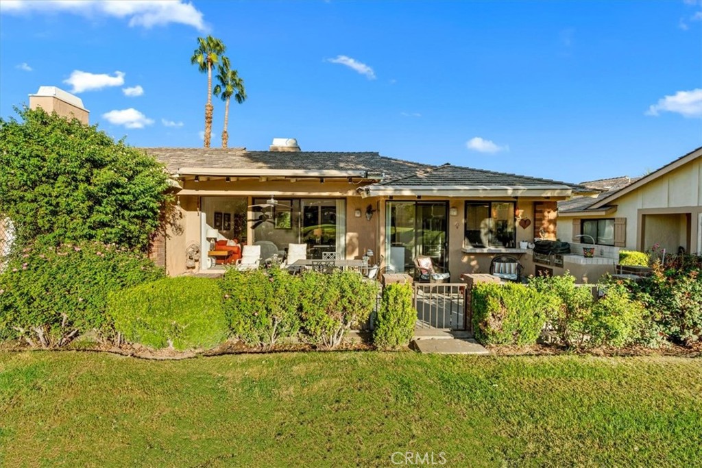 393 Gran Via Palm Desert, CA 92260 - Photo 32 of 60 a view of a house with a big yard