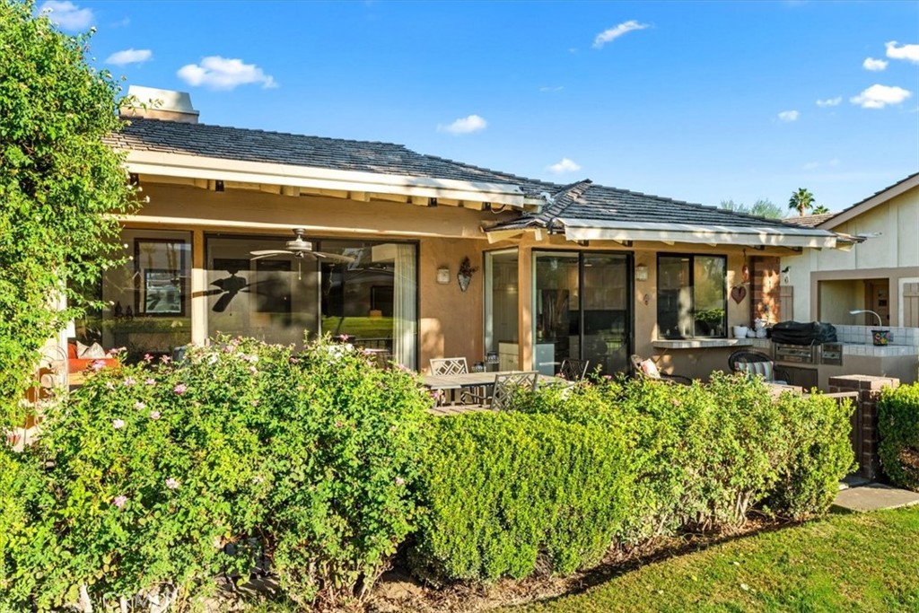 393 Gran Via Palm Desert, CA 92260 - Photo 33 of 60 front view of a house with a large window