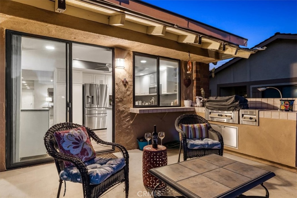 393 Gran Via Palm Desert, CA 92260 - Photo 39 of 60 a living room with furniture a table and chairs