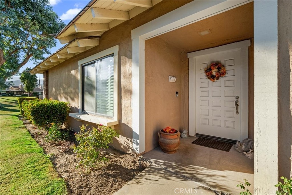 393 Gran Via Palm Desert, CA 92260 - Photo 4 of 60 a view of a entryway door front of house