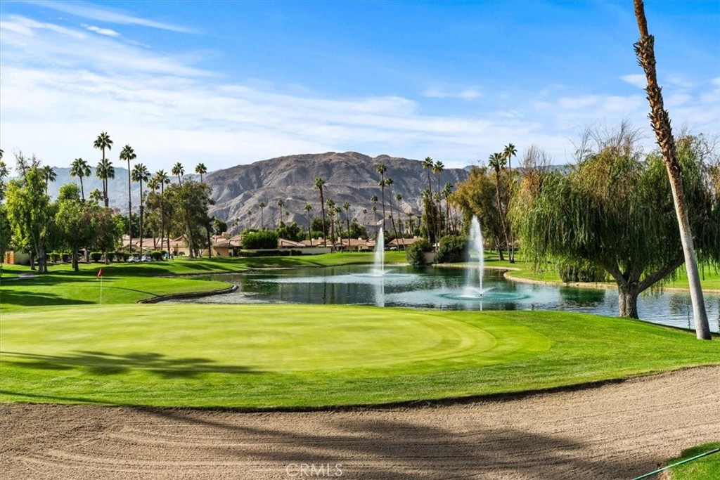 393 Gran Via Palm Desert, CA 92260 - Photo 58 of 60 a view of a swimming pool with a yard