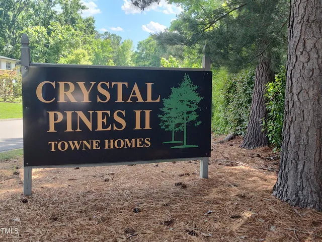 a front view of a house with garden and porch