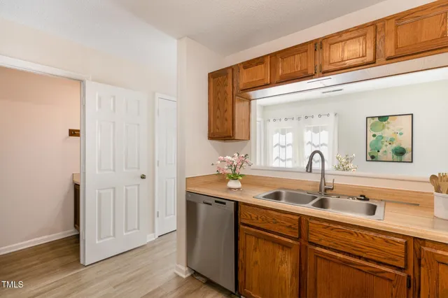 a kitchen with a sink stove and refrigerator