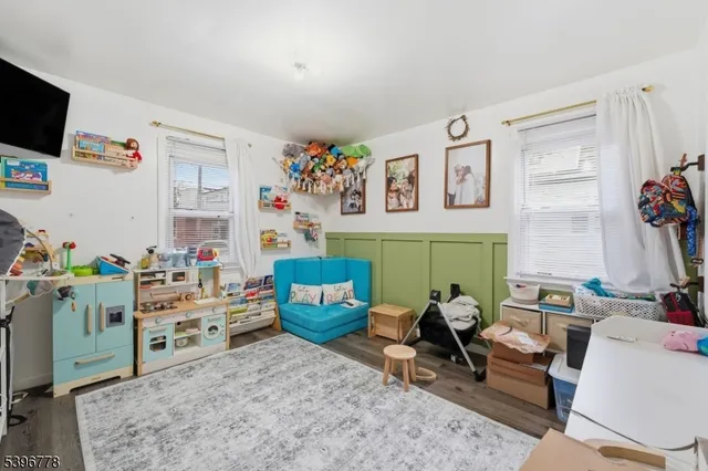 a room with furniture and a flat screen tv