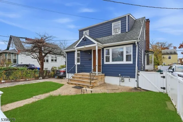 a view of a house with a yard porch and sitting area
