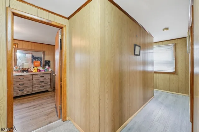 a view of a hallway and a mirror