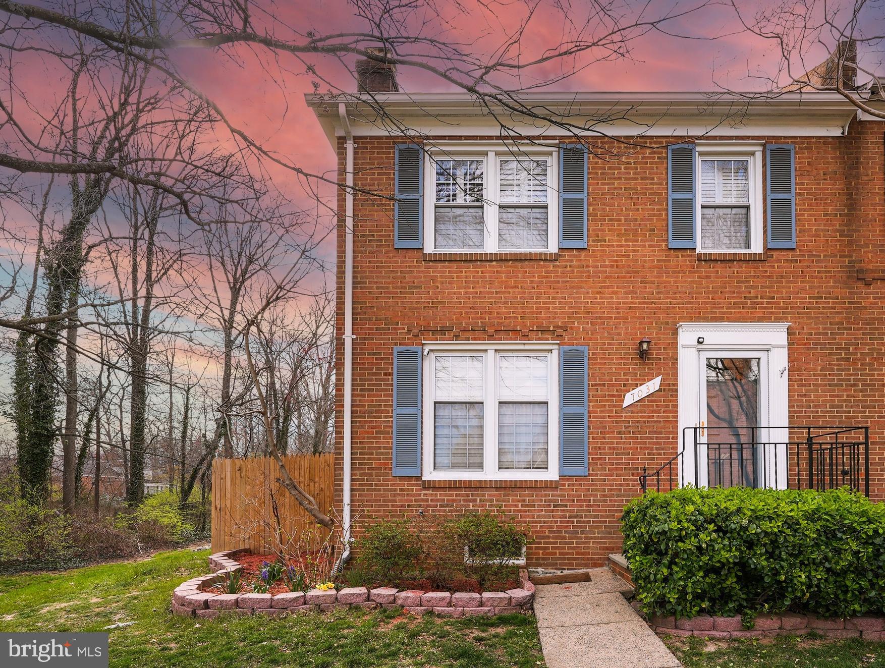 7031 Leestone Street Springfield, VA 22151 - Photo 8 of 42 a front view of a house with a yard