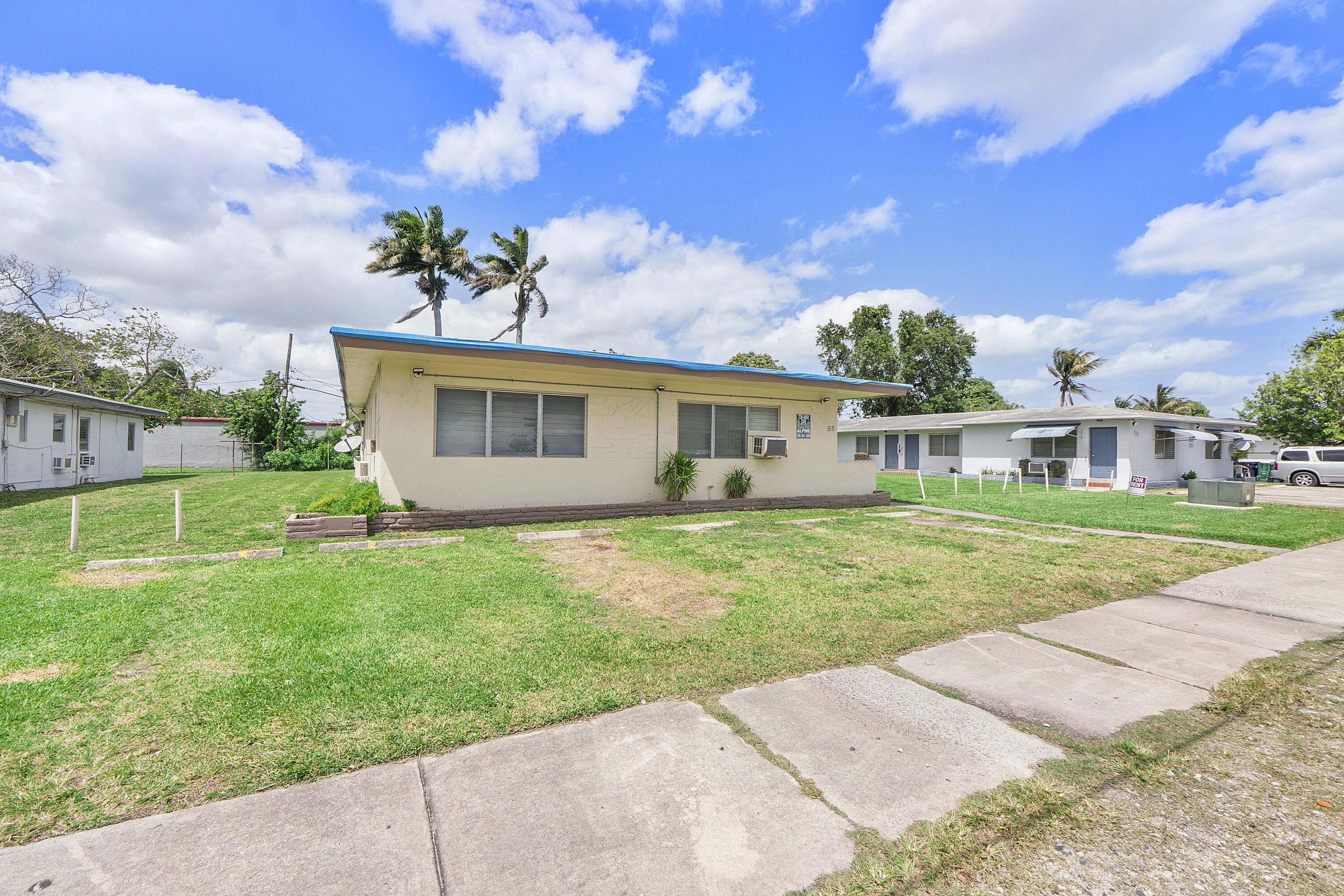 515 Northeast 150th Street, Unit 3 Miami, FL 33161 - Photo 11 of 11 front view of a house with a yard