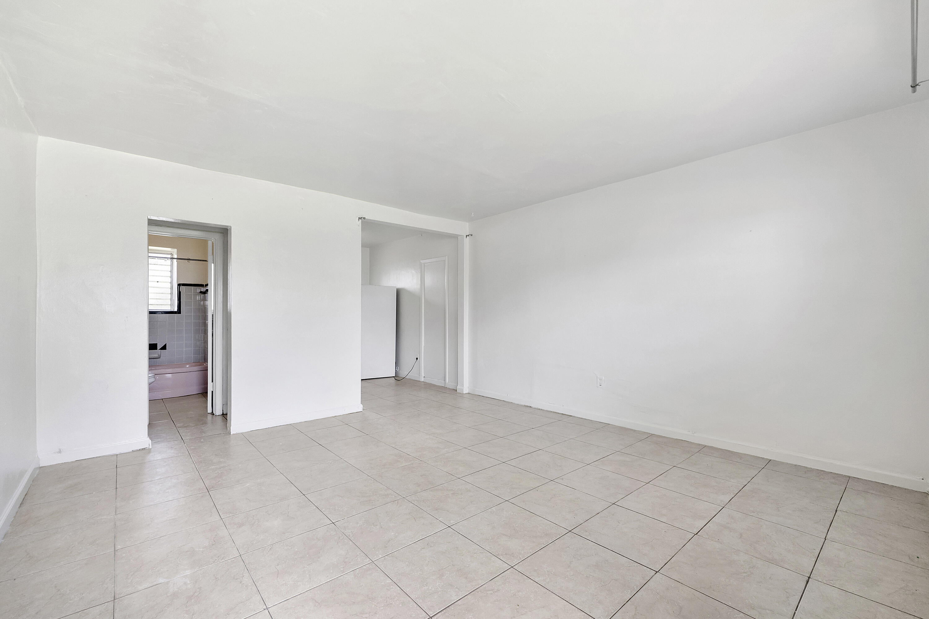 515 Northeast 150th Street, Unit 3 Miami, FL 33161 - Photo 3 of 11 a view of an empty room and closet area