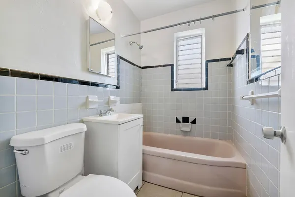 a bathroom with a toilet sink and bathtub