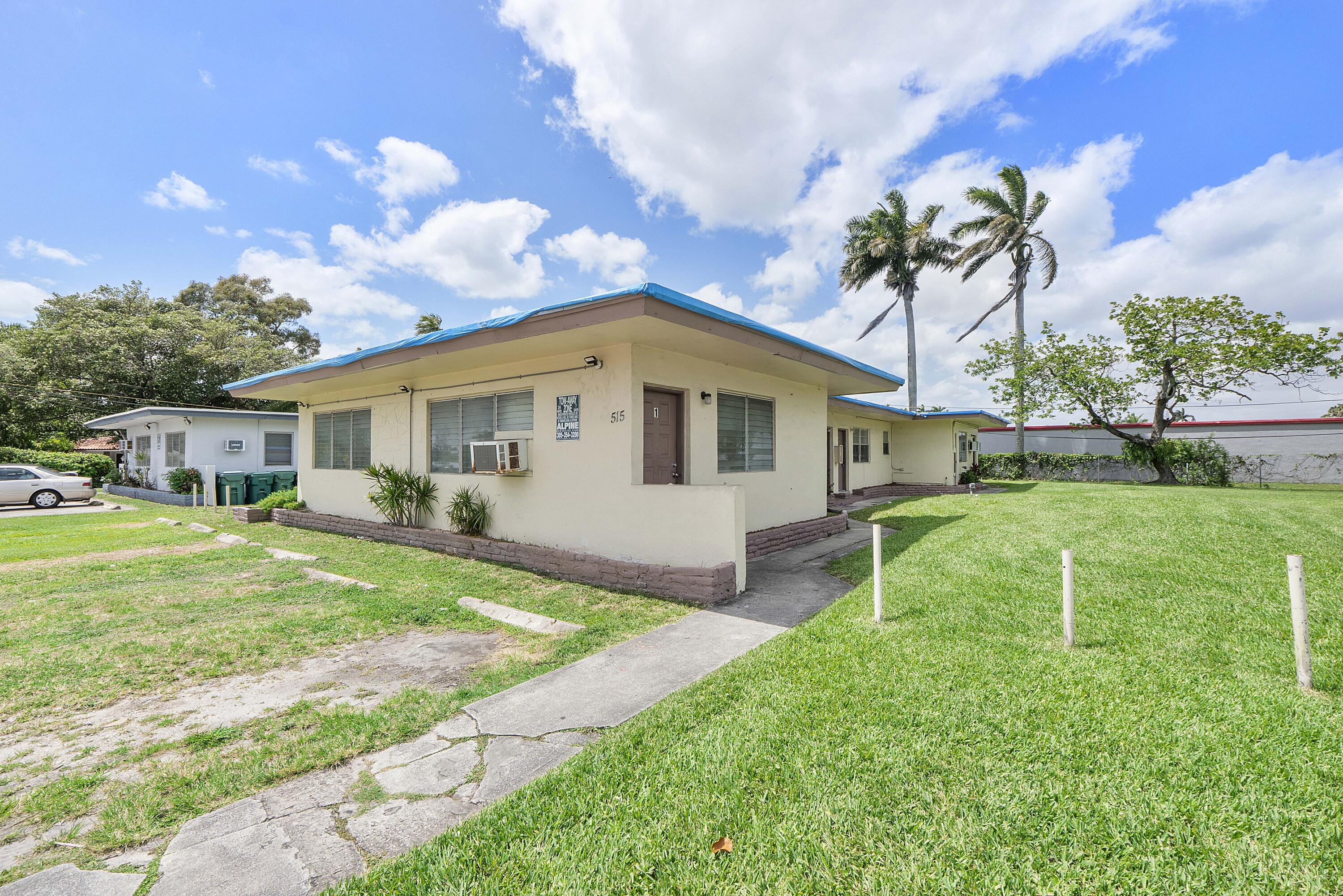 515 Northeast 150th Street, Unit 3 Miami, FL 33161 - Photo 10 of 11 a view of a house with a yard and sitting area
