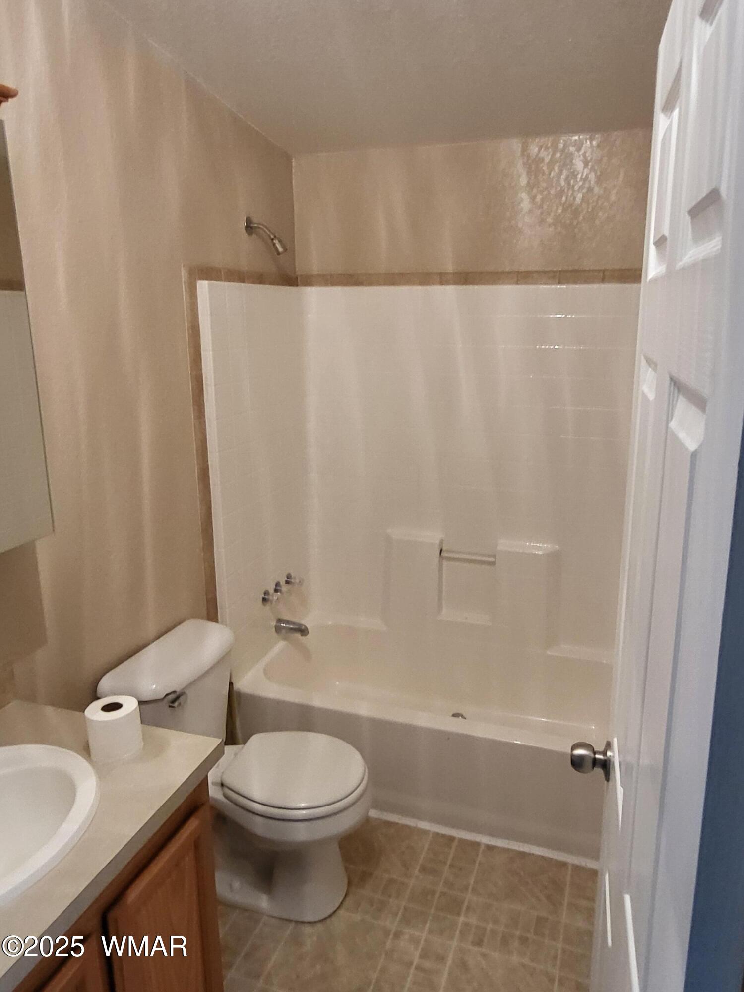 2052 Lone Mountain Road Overgaard, AZ 85933 - Photo 17 of 24 a bathroom with a toilet a sink and shower