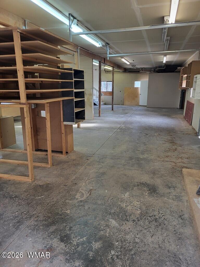 2052 Lone Mountain Road Overgaard, AZ 85933 - Photo 20 of 24 a view of an empty room with gym equipment