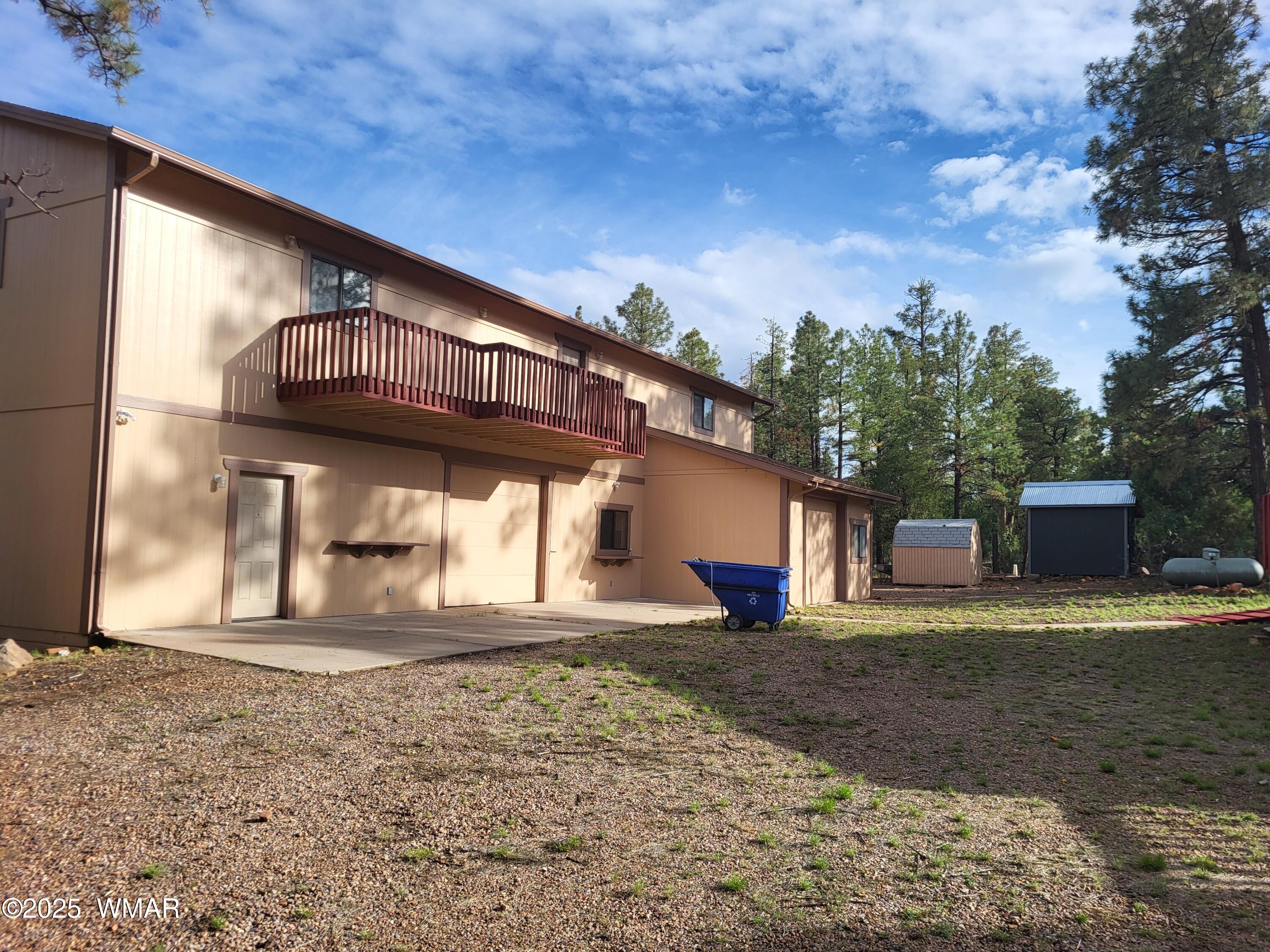 2052 Lone Mountain Road Overgaard, AZ 85933 - Photo 2 of 24 a view of a house with a yard