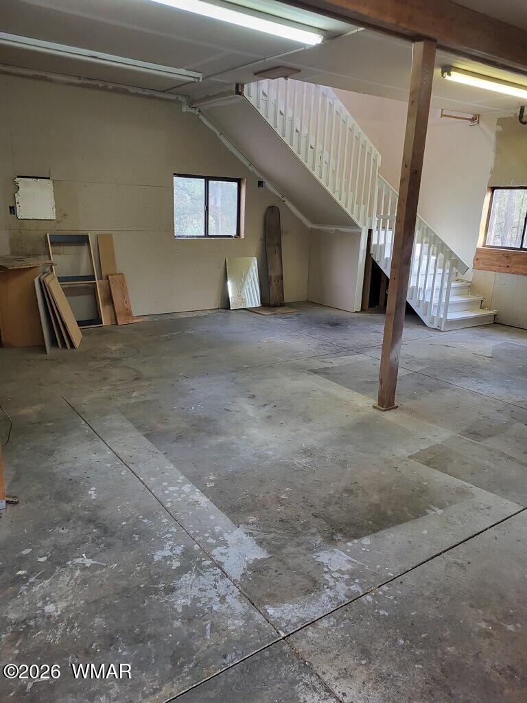 2052 Lone Mountain Road Overgaard, AZ 85933 - Photo 23 of 24 a view of a livingroom with wooden floor and furniture