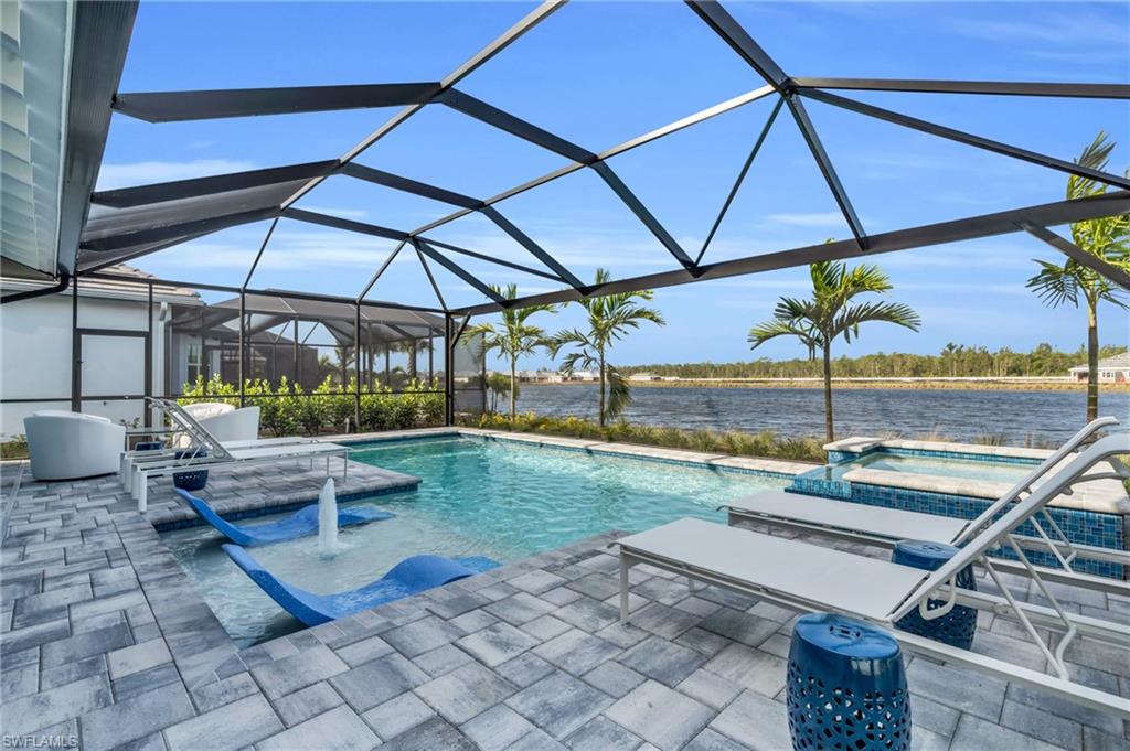 8795 Calypso Court Naples, FL 34113 - Photo 32 of 49 a view of a backyard with sitting area