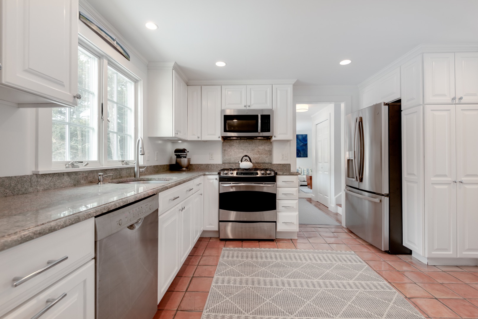 11 Sesapana Road Nantucket, MA 02554 - Photo 15 of 37 a kitchen with a refrigerator a sink and a stove top oven