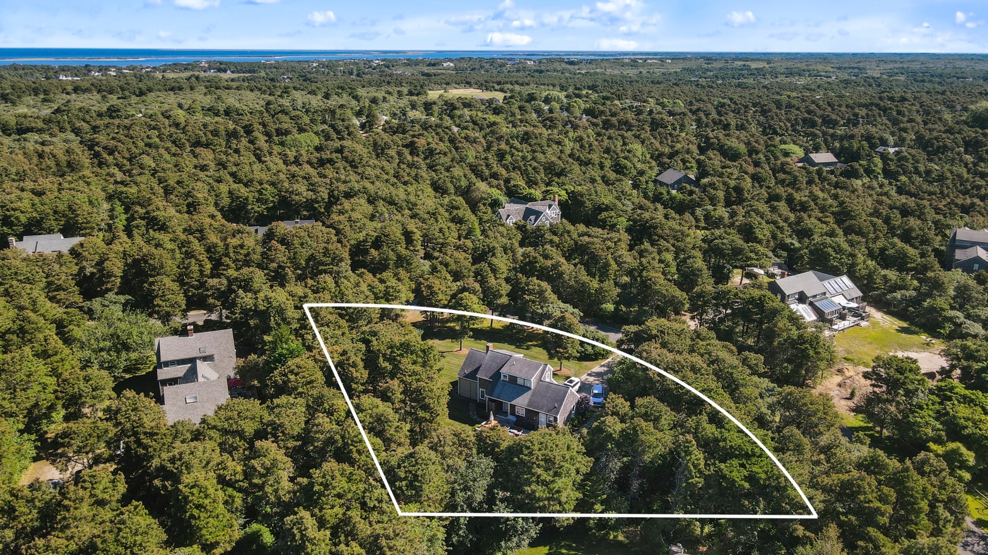 11 Sesapana Road Nantucket, MA 02554 - Photo 34 of 37 an aerial view of a house with a yard