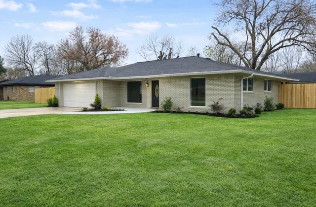 a stove top oven sitting inside of a kitchen