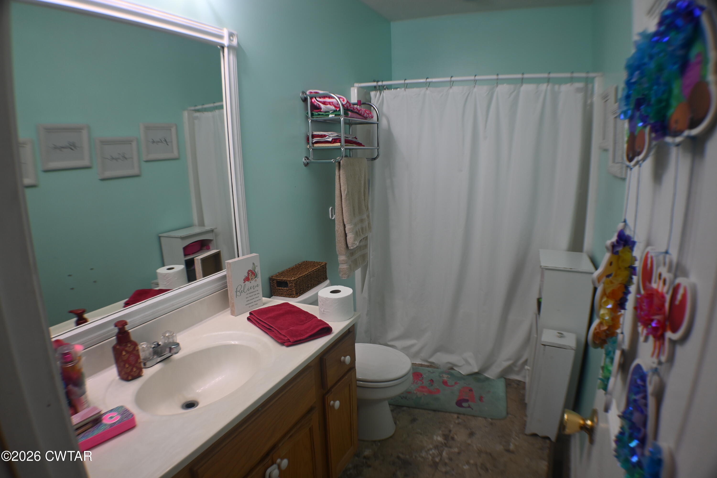 233 South Front Street Halls, TN 38040 - Photo 11 of 23 a bathroom with a sink toilet and shower