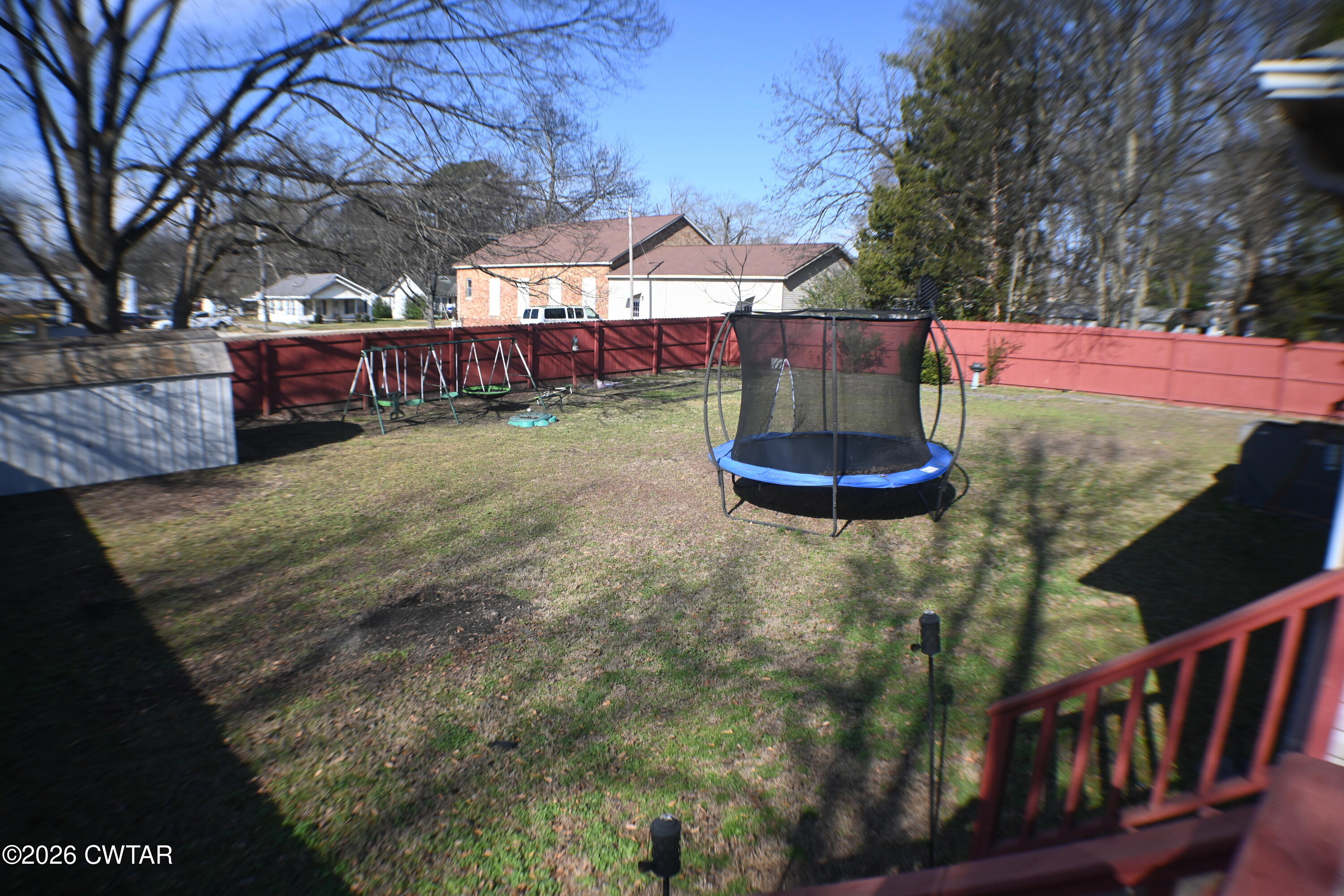 233 South Front Street Halls, TN 38040 - Photo 18 of 23 a view of a backyard with wooden fence