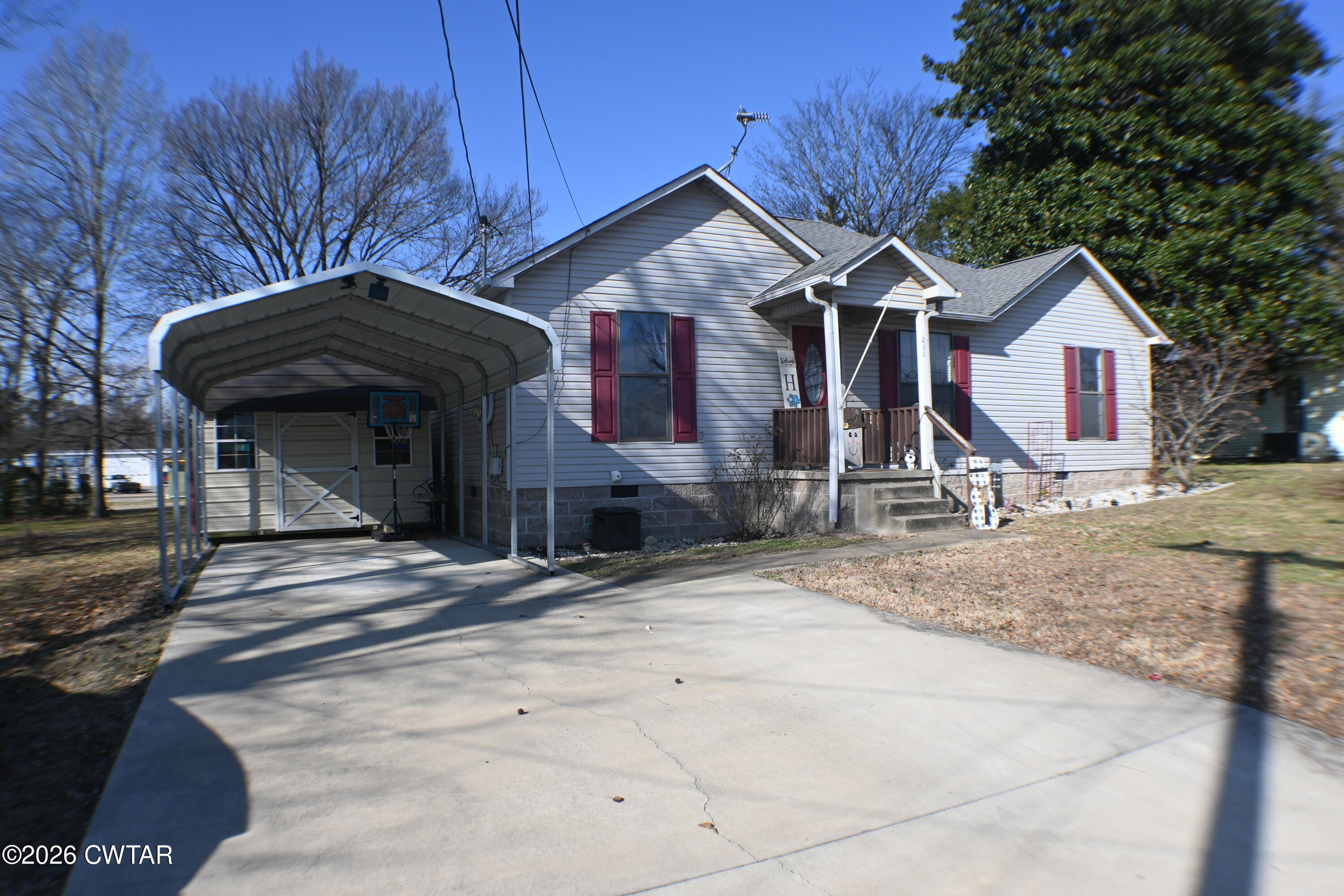 233 South Front Street Halls, TN 38040 - Photo 3 of 23 a front view of a house with a yard
