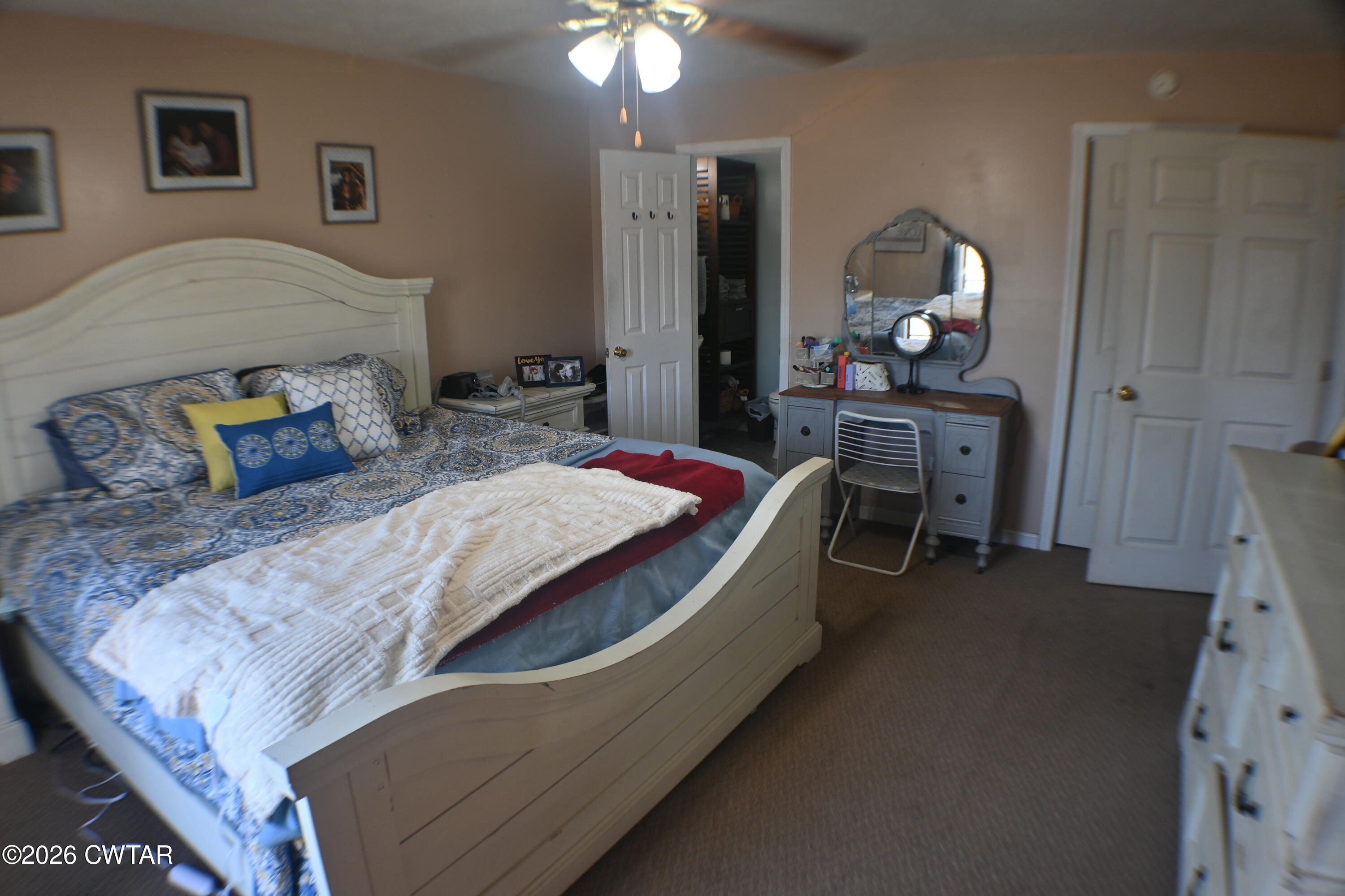 233 South Front Street Halls, TN 38040 - Photo 7 of 23 a bed room with a bed mirror and a table
