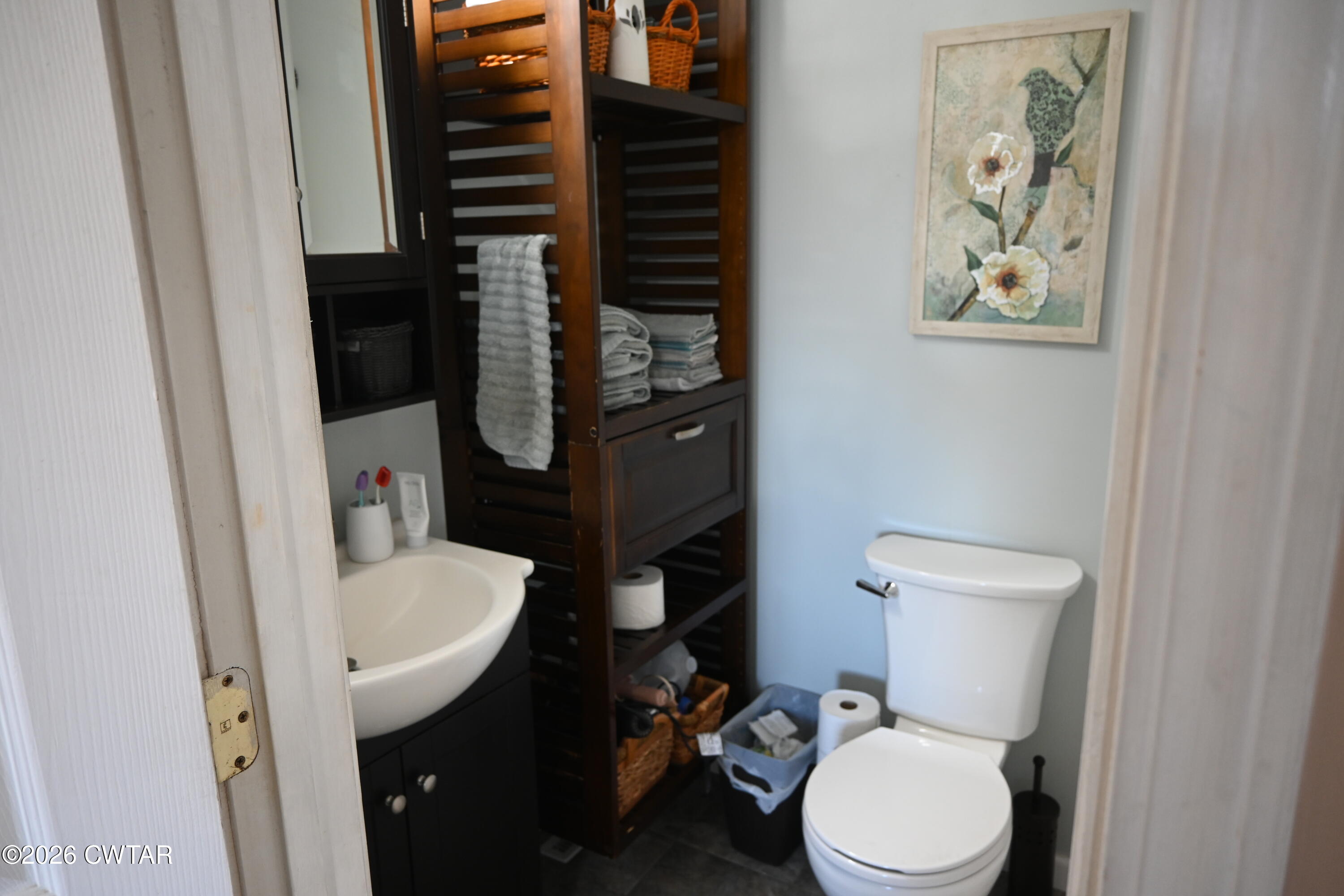 233 South Front Street Halls, TN 38040 - Photo 8 of 23 a white toilet sitting next to a bathroom sink