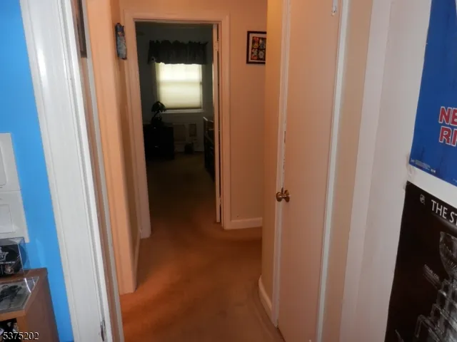 a view of a livingroom from a hallway