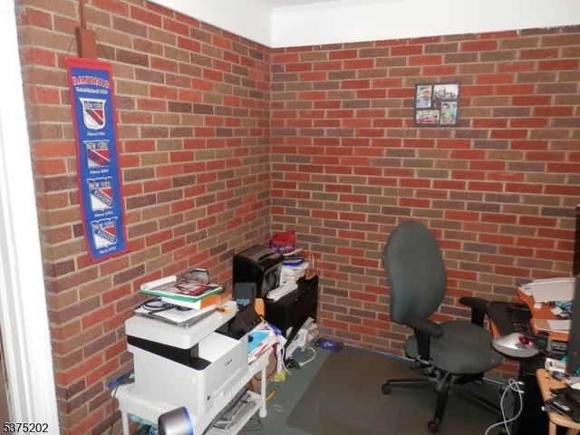 a view of a workspace with furniture