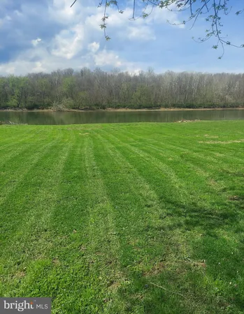 a view of outdoor space with deck and lots of green space