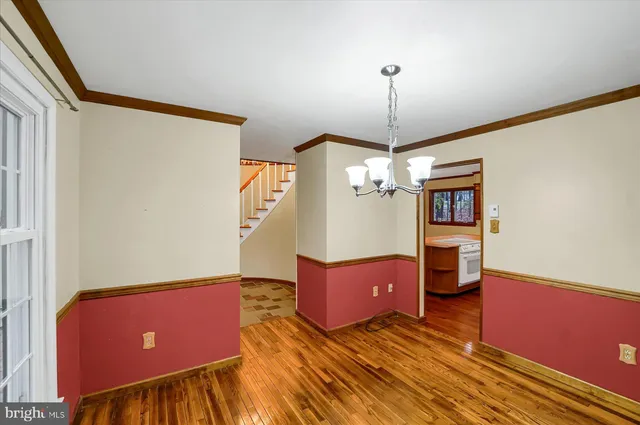 a view of a room with a windows and cabinet