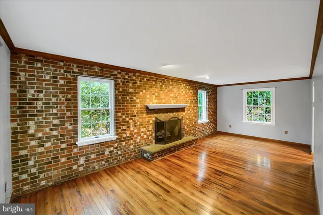a view of a fireplace with wooden floor