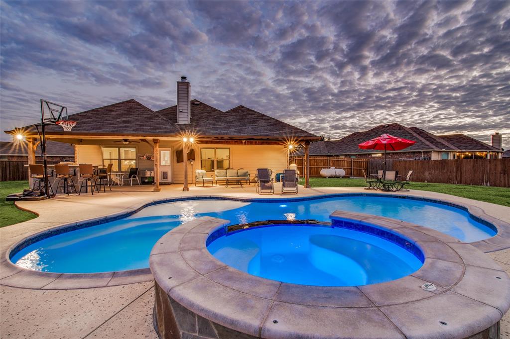 a swimming pool with outdoor seating