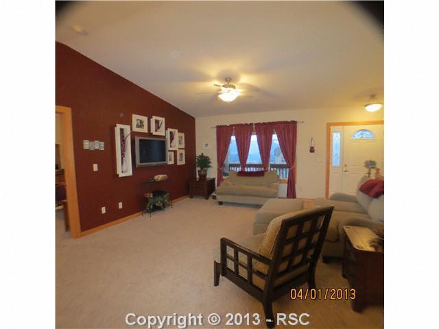 15351 Ridgefield Lane Colorado Springs, CO 80921 - Photo 4 of 15 Notice mountain view in windows. Vaulted ceilings