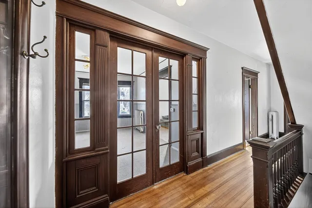 a view of a entryway with wooden floor and stairs
