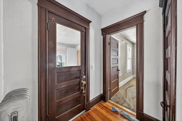 a view of front door and bedroom