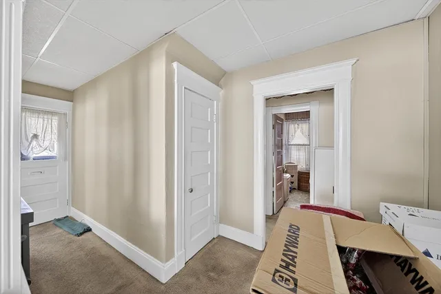 a bed room with a bed and a view of bedroom