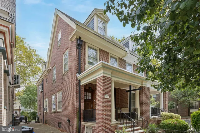 a view of a building with a tree
