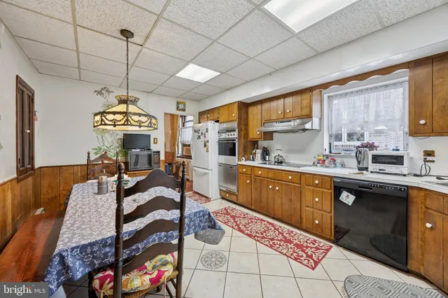 a large kitchen with a large window