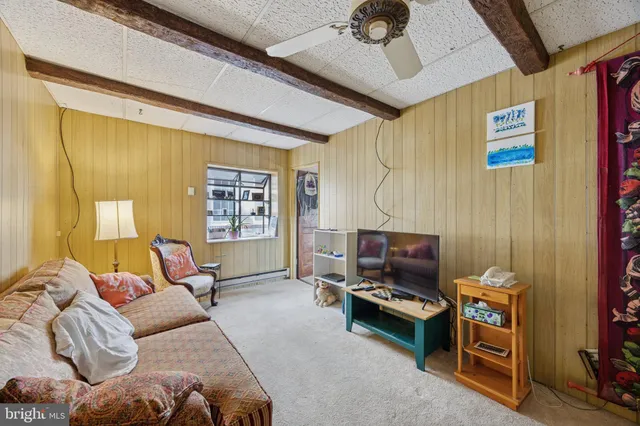 a living room with furniture and a window