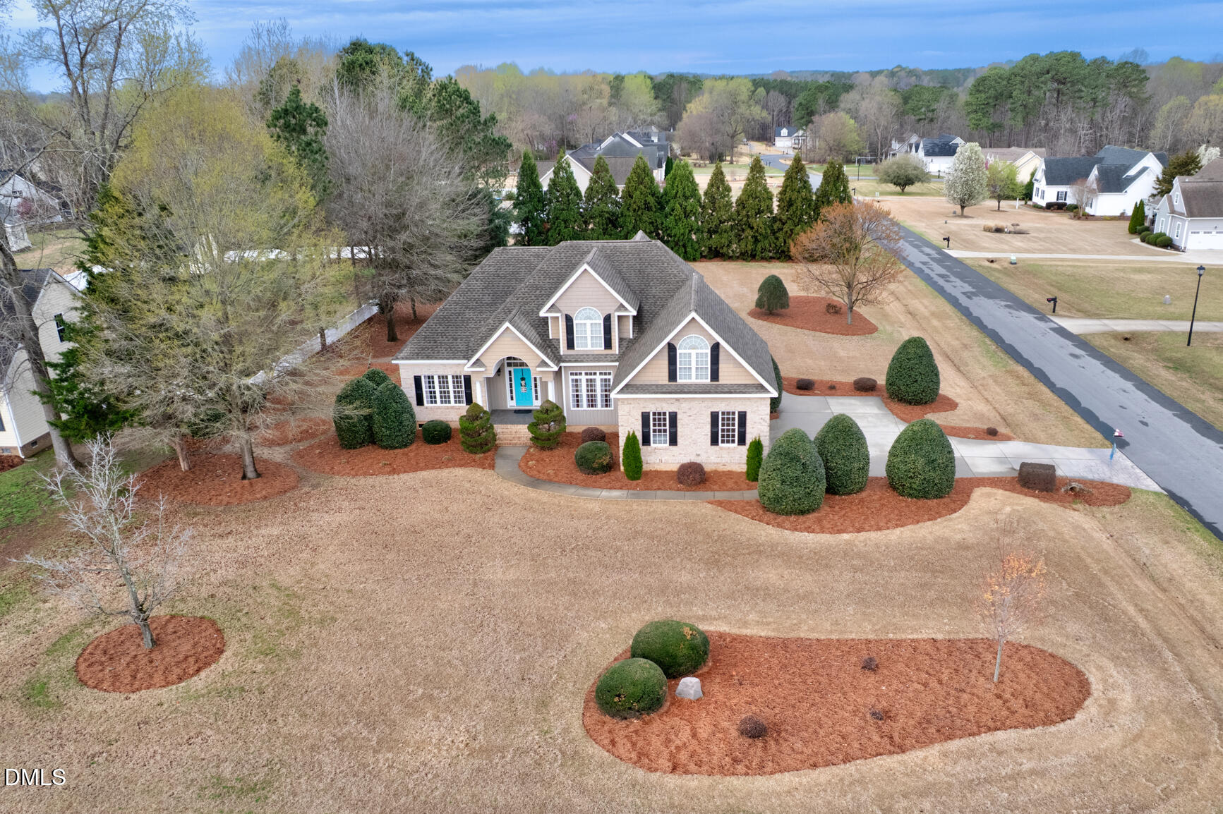 a view of a white house with a swimming pool and outdoor seating