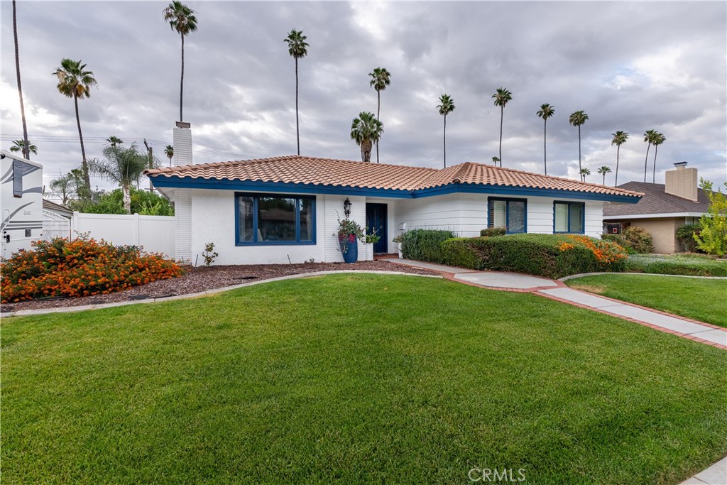 4967 Chapala Drive Riverside, CA 92507 - Photo 4 of 34 a view of a house with a backyard and a garden