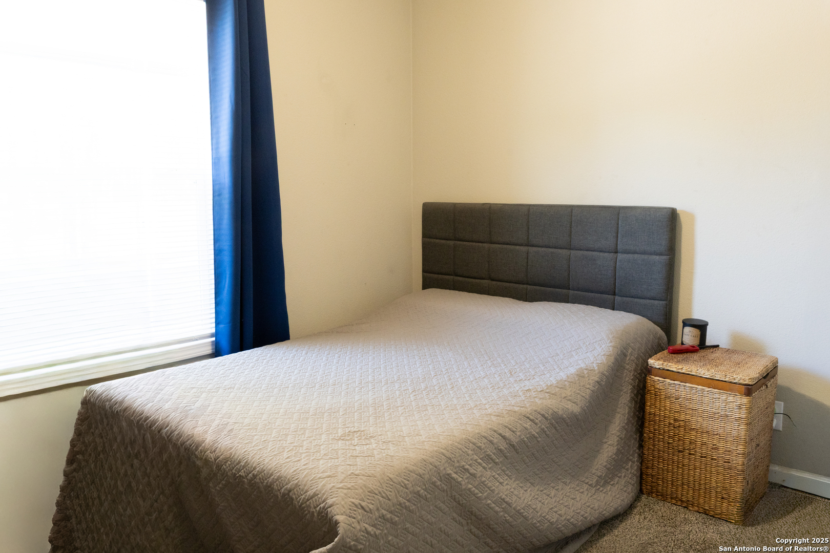 118 Flatrock Lane Junction, TX 76849 - Photo 11 of 18 a bed sitting in a bedroom next to a window